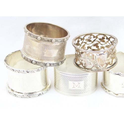 1017 - 9 assorted silver napkin rings, various dates and makers but all with English hallmarks, approx 234.... 