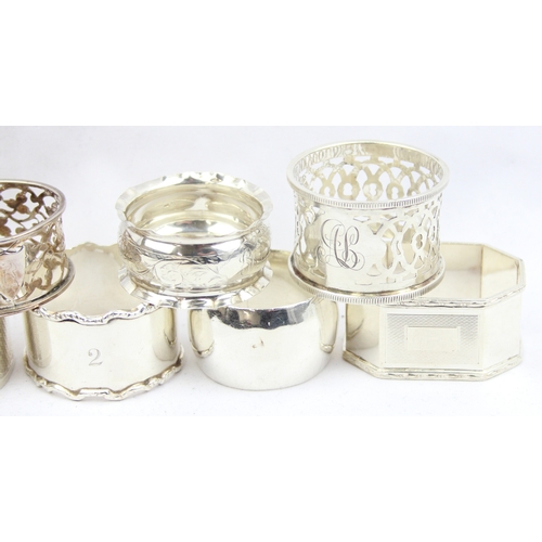 1017 - 9 assorted silver napkin rings, various dates and makers but all with English hallmarks, approx 234.... 