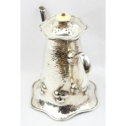 1056 - An impressive Mappin & Webb silver plate coffee pot in the Art Nouveau manner with hammered finish, ... 