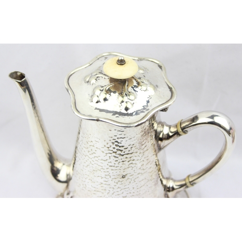 1056 - An impressive Mappin & Webb silver plate coffee pot in the Art Nouveau manner with hammered finish, ... 