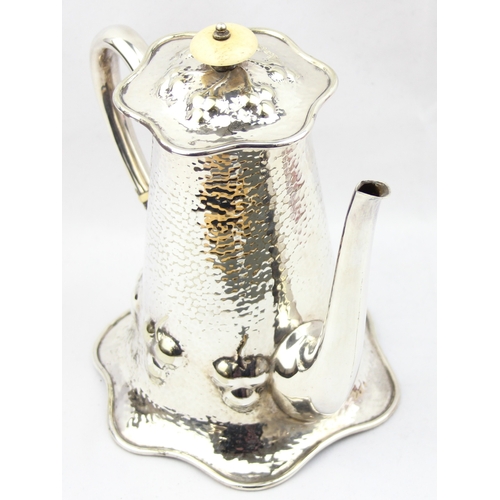 1056 - An impressive Mappin & Webb silver plate coffee pot in the Art Nouveau manner with hammered finish, ... 