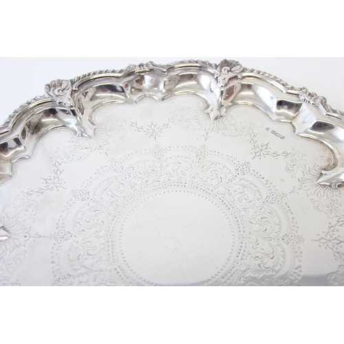 1069 - A large and very impressive early 20th century silver tray with engraved decoration, marked for Shef... 