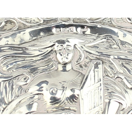 1072 - A silver mounted Art Nouveau designed hand mirror, depicting a female figure playing a harp, marked ... 