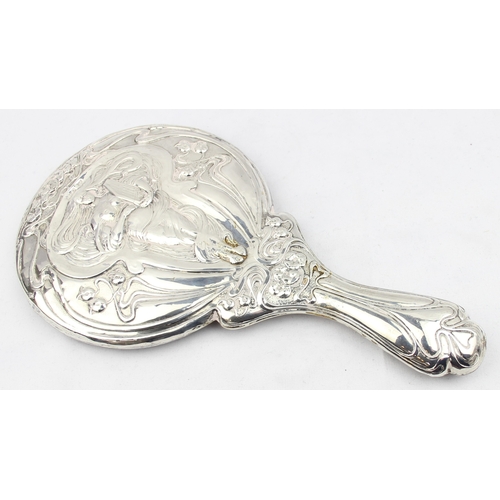 1072 - A silver mounted Art Nouveau designed hand mirror, depicting a female figure playing a harp, marked ... 