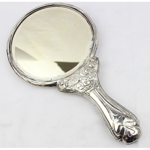 1072 - A silver mounted Art Nouveau designed hand mirror, depicting a female figure playing a harp, marked ... 