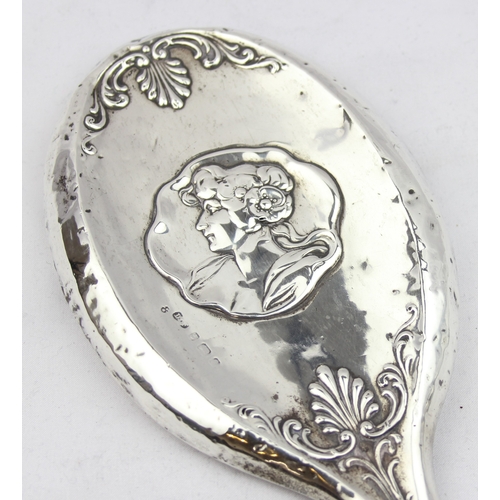 1073 - A silver mounted Art Nouveau designed hand mirror, depicting a female bust, marked for Birmingham 19... 