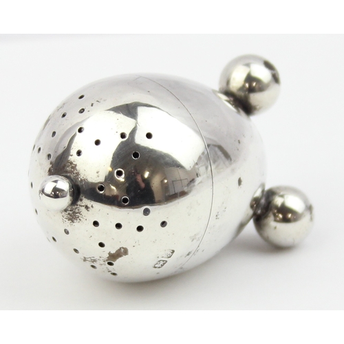 1074 - An unusual silver pepperette of ovoid form, Chester 1909 by Edward John Haseler & Noble Haseler, app... 