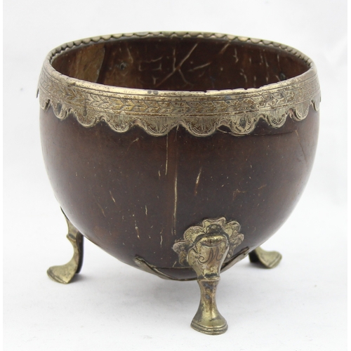 1000 - An 18th century silver mounted coconut cup, the coconut with plain body and mounted with a silver ri... 