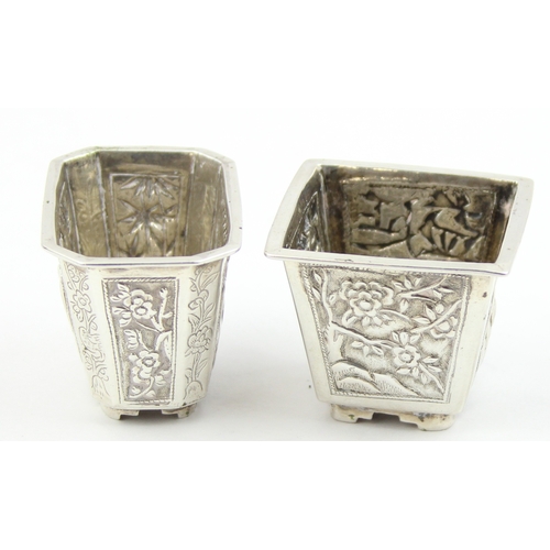 1091 - 2 Chinese silver salts with embossed decoration, one marked for Cum Wo of Hong Kong, the other unmar... 