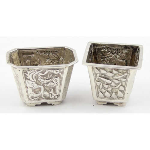 1091 - 2 Chinese silver salts with embossed decoration, one marked for Cum Wo of Hong Kong, the other unmar... 