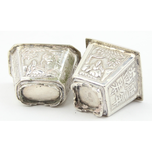 1091 - 2 Chinese silver salts with embossed decoration, one marked for Cum Wo of Hong Kong, the other unmar... 