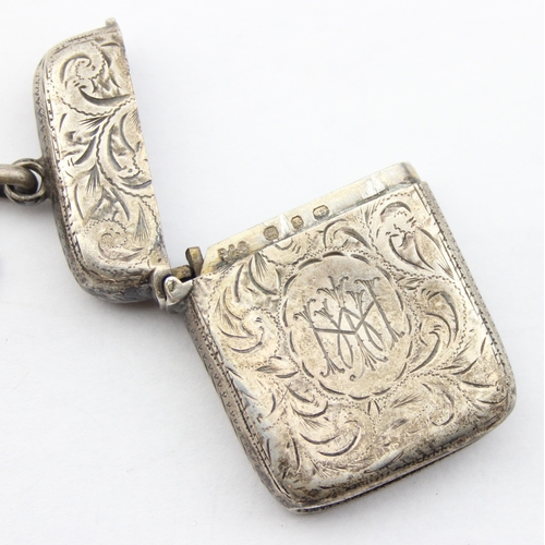 1099N - An antique silver vesta case with engraved decoration, Birmingham 1897 on an unmarked silver but XRF... 