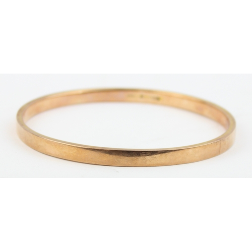 1100 - A 9ct gold plain band bangle, Birmingham 1971, approx 75mm in diameter, approx 9.02g gross