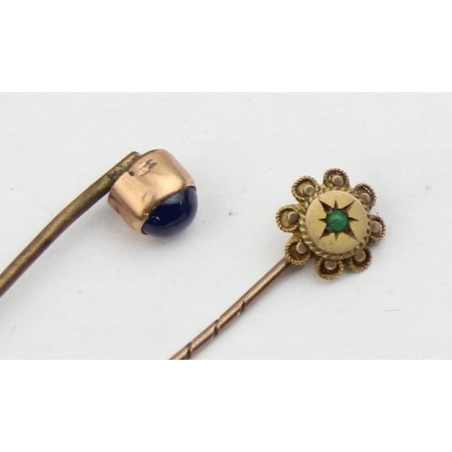 1102 - 2 antique 9ct gold mounted stick pins, one with a blue cabochon stone, the other set with turquoise ... 