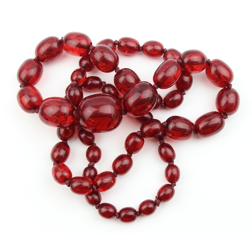 1106 - An unusual vintage crackle red bead necklace, possibly an early Bakelite like plastic and similar co... 