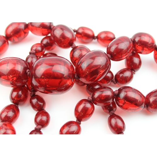 1106 - An unusual vintage crackle red bead necklace, possibly an early Bakelite like plastic and similar co... 