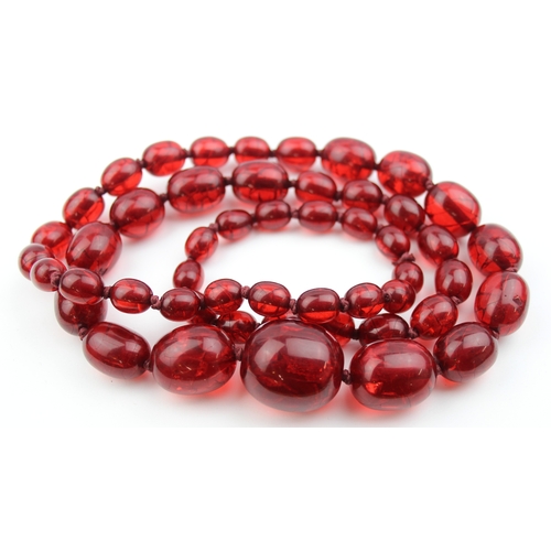 1106 - An unusual vintage crackle red bead necklace, possibly an early Bakelite like plastic and similar co... 