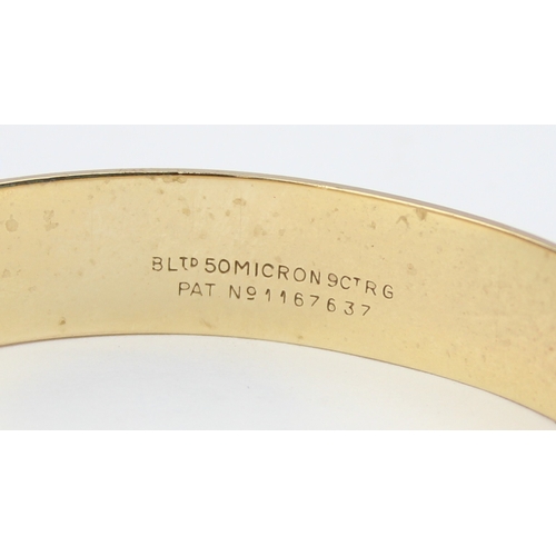 1118 - A vintage rolled gold bangle with engraved decoration, marked B Ltd 50 Micron 9ct RG Pat No 1167637,... 