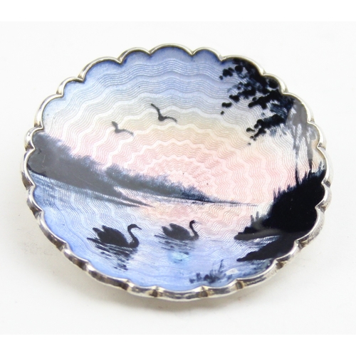 1134 - A retro Norwegian silver and enamel brooch depicting swans in silhouette at sunset, marked to revers... 