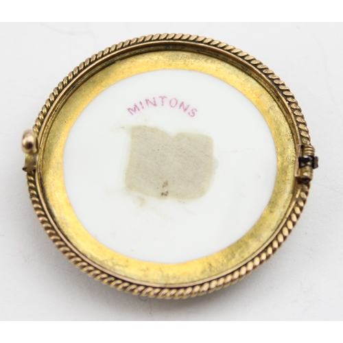 1135 - An antique painted Minton porcelain roundel formed as a brooch mounted in 9ct gold, the plaque hand ... 