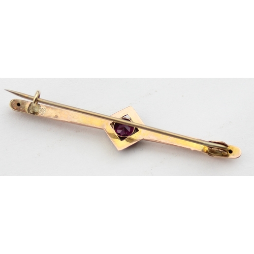 1140 - An antique 9ct gold and amethyst bar brooch, indistinctly marked and XRF confirmed, presented in per... 