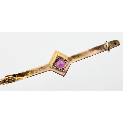 1140 - An antique 9ct gold and amethyst bar brooch, indistinctly marked and XRF confirmed, presented in per... 