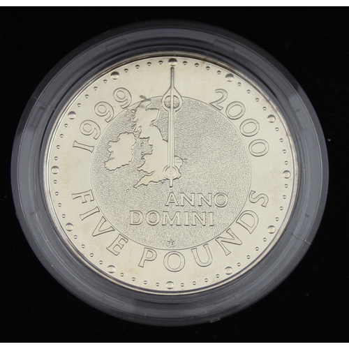 1202 - Royal Mint 1999 one ounce fine silver Britannia coin and a 2000 cupro-nickel £5 coin, both presented... 