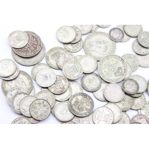 1205 - A large qty of assorted British coins with silver content, half crowns down to three pence coins, ne... 