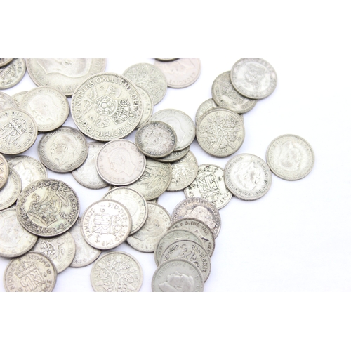 1205 - A large qty of assorted British coins with silver content, half crowns down to three pence coins, ne... 