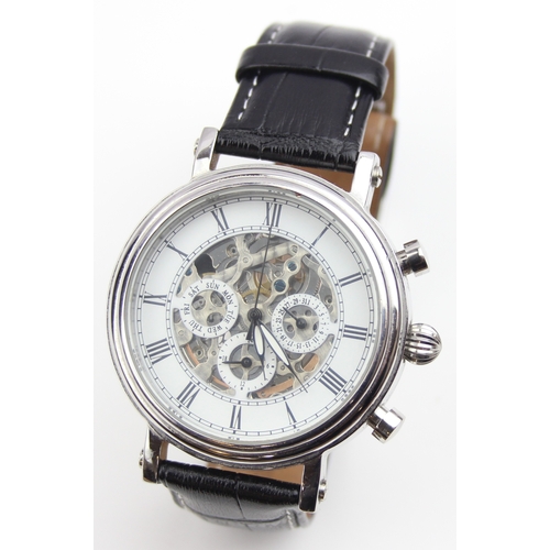 1308 - TCM skeleton wristwatch with automatic movement, black crocodile effect leather strap and some paper... 