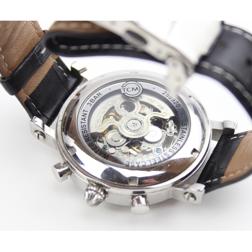 1308 - TCM skeleton wristwatch with automatic movement, black crocodile effect leather strap and some paper... 