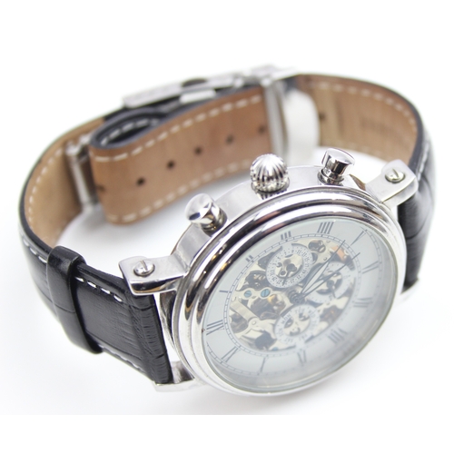 1308 - TCM skeleton wristwatch with automatic movement, black crocodile effect leather strap and some paper... 