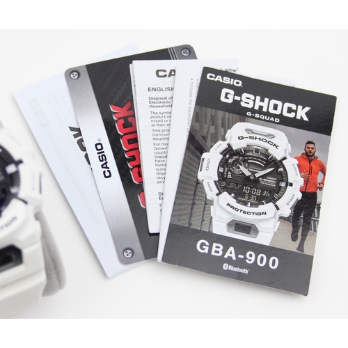 1317 - A Casio G-Shock GBA-900 watch with white plastic strap and some paperwork