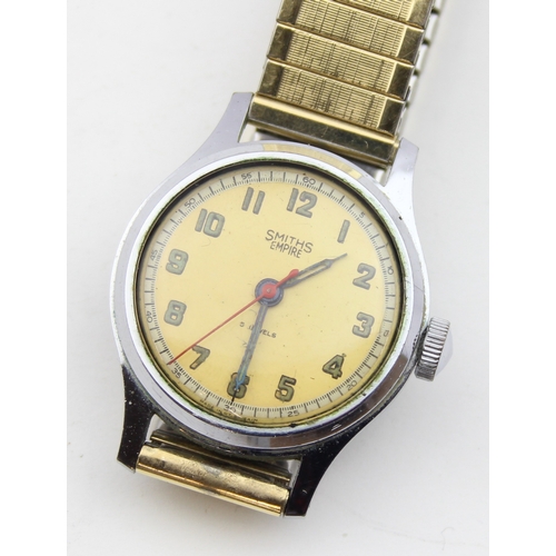 1337 - A vintage Smith's Empire wristwatch with luminous numerals and stainless steel case, replacement exp... 