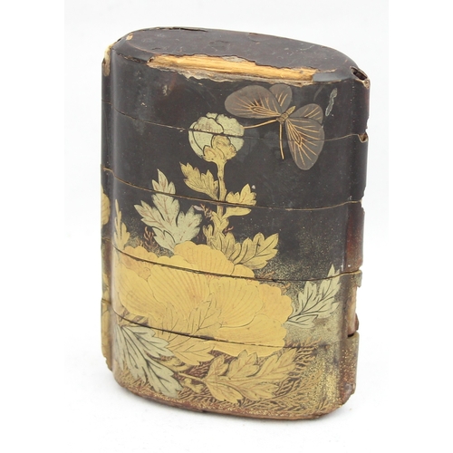 1409 - An antique Japanese lacquer 5 section inro decorated with gold and silver lacquer showing flowers an... 