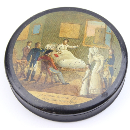 1451 - An early 19th century lacquered papier mache circular snuff box printed with a crowded tavern scene,... 