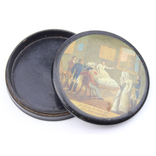 1451 - An early 19th century lacquered papier mache circular snuff box printed with a crowded tavern scene,... 