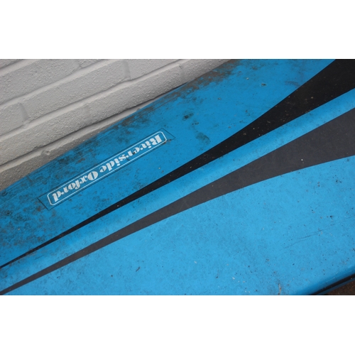 741 - A long blue fibreglass canoe or kayak, approx 405cm long