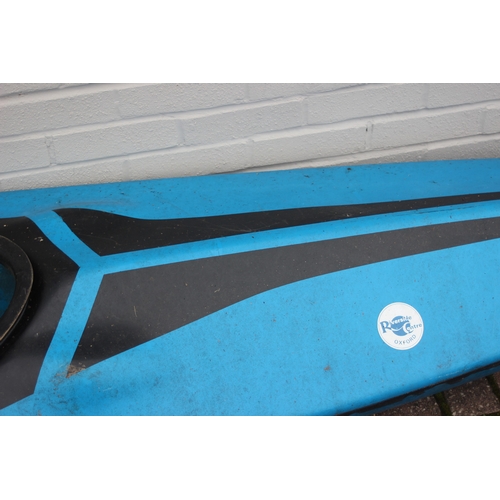 741 - A long blue fibreglass canoe or kayak, approx 405cm long