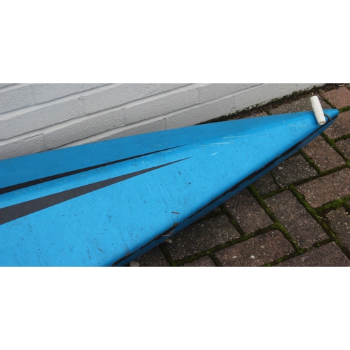 741 - A long blue fibreglass canoe or kayak, approx 405cm long