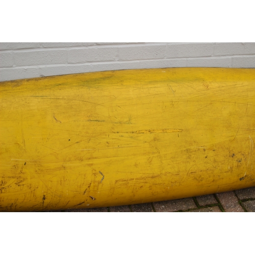 742 - A long yellow fiberglass canoe or kayak, approx 405cm long