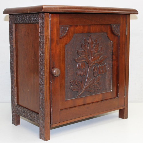 288 - An Arts & Crafts period mahogany table cabinet with floral carved door, later interior, approx 41cm ... 