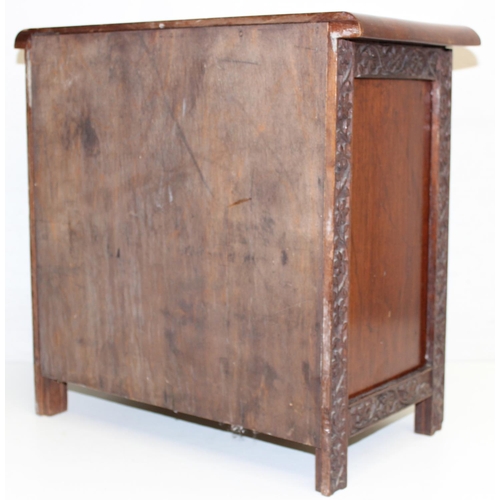 288 - An Arts & Crafts period mahogany table cabinet with floral carved door, later interior, approx 41cm ... 