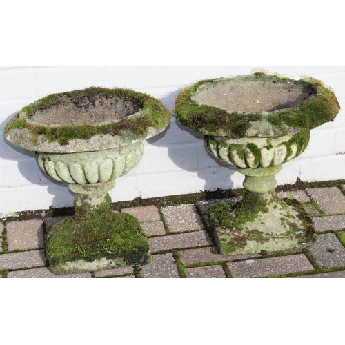 305 - A pair of antique style weathered stone or concrete garden urns with moss coverings, each approx 40c... 