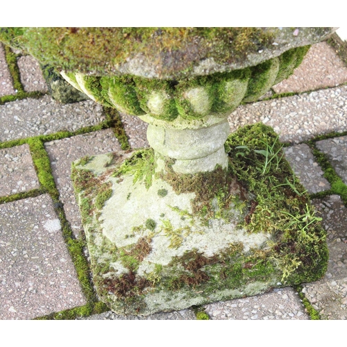 305 - A pair of antique style weathered stone or concrete garden urns with moss coverings, each approx 40c... 