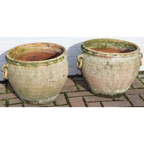 307 - A pair of weathered terracotta bulbous designed garden planters with ring handles, each approx 42cm ... 