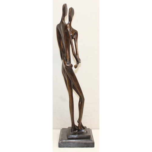 374B - A heavy bronzed metal sculpture of an embraced naked couple, seemingly unsigned, on marble base, mad... 