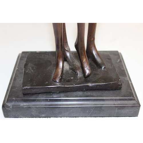 374B - A heavy bronzed metal sculpture of an embraced naked couple, seemingly unsigned, on marble base, mad... 