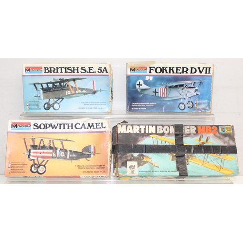 652 - 4 vintage model kits of WW1 bi-planes, 3 by Monogram, unchecked for completeness