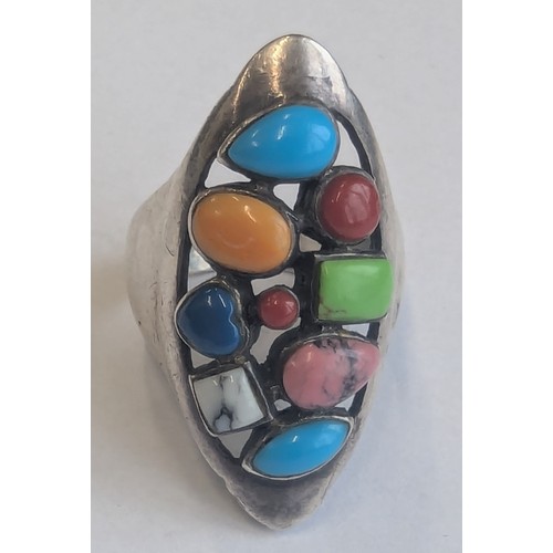 1149 - A retro style 925 silver ring set with a large number of multi-coloured cabochon stones, possibly Am... 